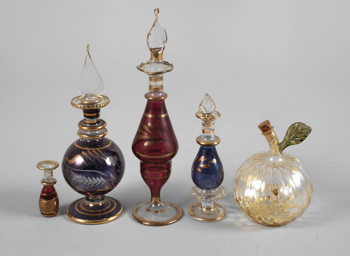 Five small perfume bottles