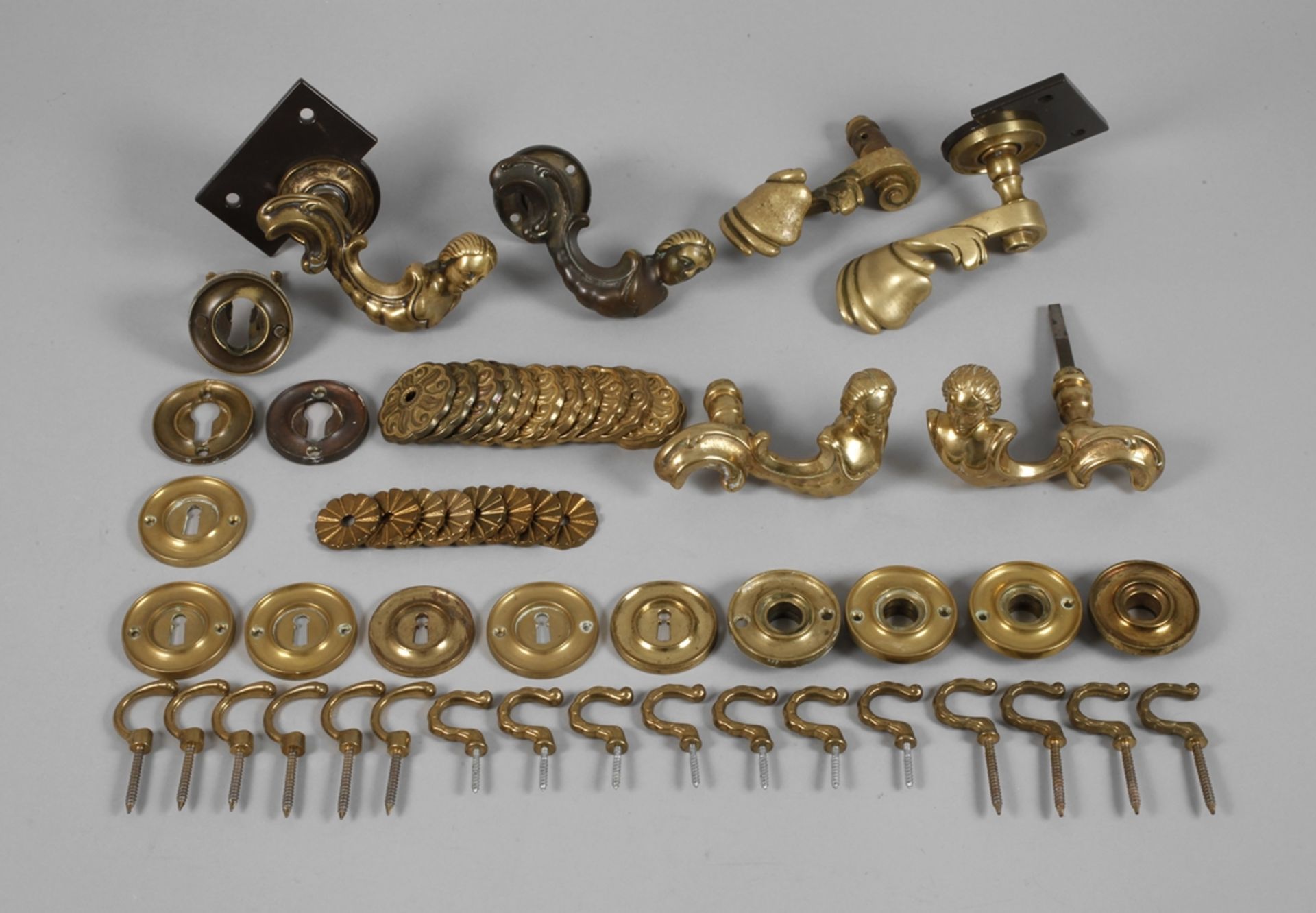 A collection of historical door handles