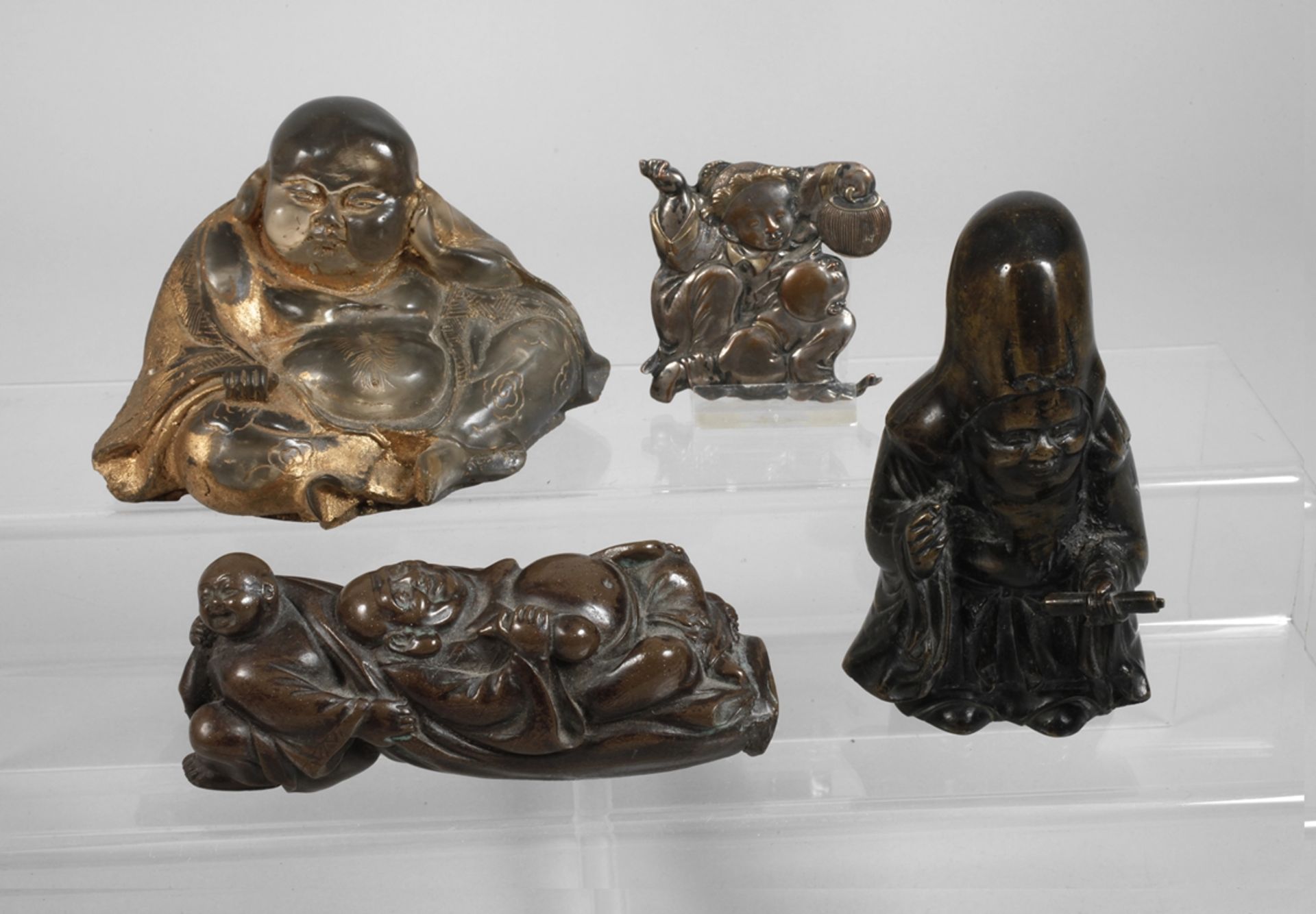 A collection of Asian figurines