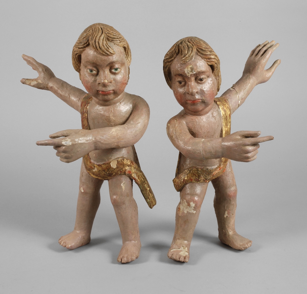 Two carved putti