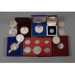 A collection of silver coins and medals