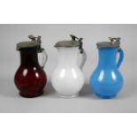 Three decorative jugs with eagle handles