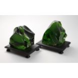 Pair of dark green glass pieces