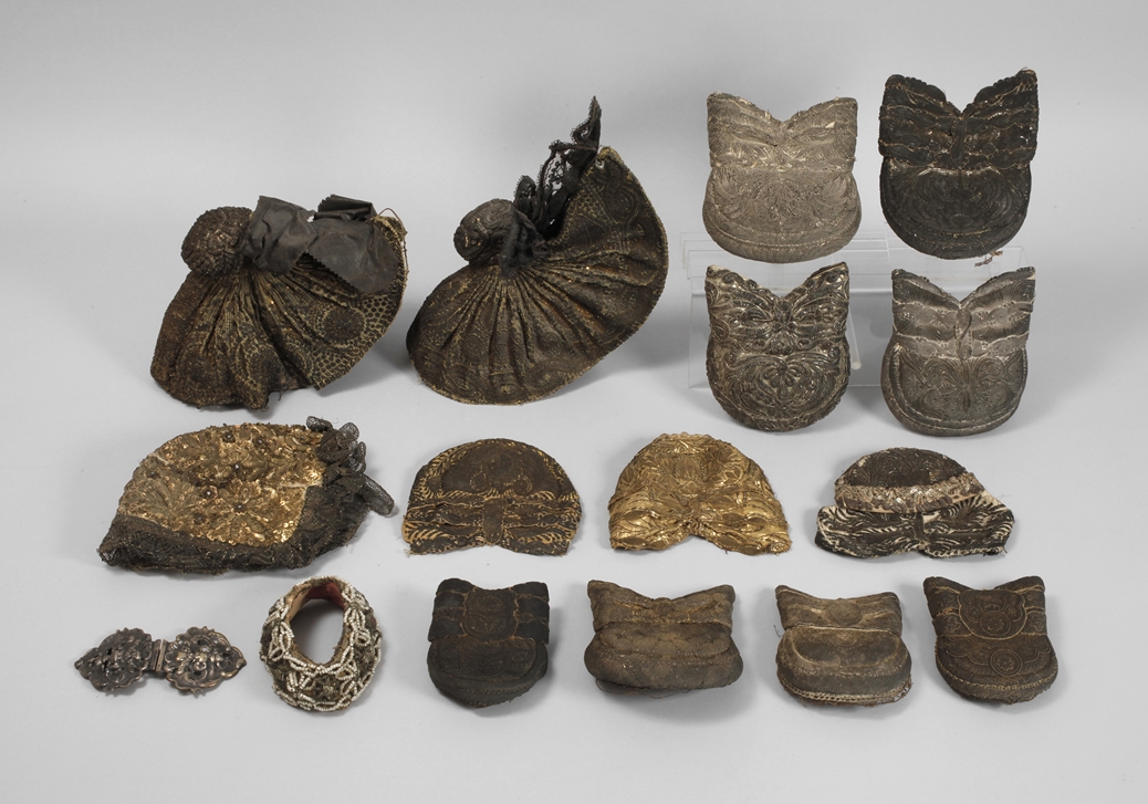 Collection of silver and gold bonnets
