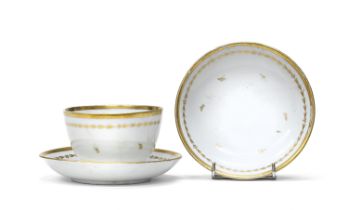 PORCELAIN CUP AND TWO SAUCERS END OF THE 19TH CENTURY