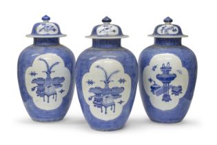 TWO WHITE AND BLUE PORCELAIN JARS WITH LIDS JAPAN 19TH CENTURY. RESTORATION TO ONE OF THE LIDS
