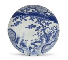 A BIG WHITE AND BLUE PORCELAIN PLATE JAPAN LATE 10TH CENTURY