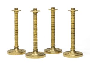 FOUR GILT BRONZE CANDLESTICKS EARLY 19TH CENTURY