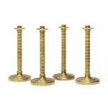 FOUR GILT BRONZE CANDLESTICKS EARLY 19TH CENTURY