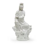 A CHINESE WHITE PORCELAIN SCULPTURE DEPICTING GUANYIN FIRST HALF 20TH CENTURY.