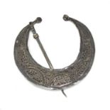 A BERBER SILVER-PLATED CLOAK CLASP. EARLY 20TH CENTURY.