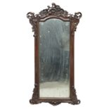 A FAR EASTERN MAHOGANY MIRROR. 20TH CENTURY.