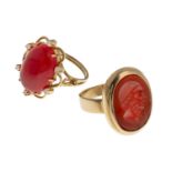 TWO GOLD RINGS WITH CORAL AND CARNELIAN