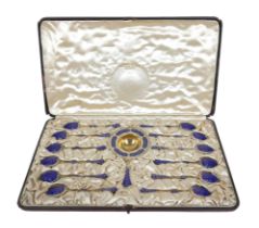 David Andersen for Tiffany & Co, a thirteen piece silver gilt and enamel tea spoon and strainer set