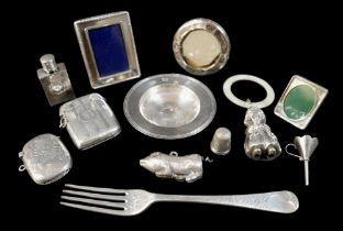 A selection of eleven silver items, to include two vestas, a miniature Armada dish, a photograph