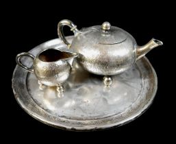 A German 800 grade silver three-piece part bachelor's tea set, fur effect decoration, comprising