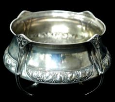 An Arts & Crafts silver bowl, with four handles, decorated with foliate designs, William Hair
