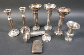 A small collection of silver items, comprising two pairs of silver weighted vases, 16cm high, a