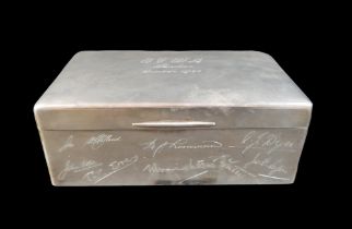 An Edwardian silver cigarette box, with presentation engraving 'Abadan October 1938' and a