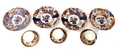 A group of four Japanese 19th century plates, decorated in the Imari palette, with scalloped rims,
