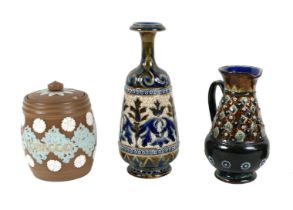 Three Royal Doulton stonewares, comprising a tobacco jar, 13cm high, a jug, 15.5cm high, and vase,