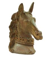 A terracotta sculpture of a heraldic horse's head, with coronet around its neck, 33 by 26 by 41cm