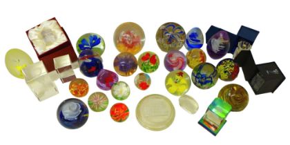 A large collection of modern glass paperweights, including floral and millefiori, most unmarked. (