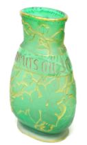 A Daum Freres green glass vase circa 1890 with the motto "Je Meurs ou je m'attache" (I die where I