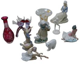 Four Lladro figurines, including a Lladro figurine of a girl with three geese, 23cm high, together