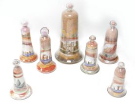 A collection of seven Victorian Alum Bay coloured sand dome ornaments, ranging from 12cm to 22cm