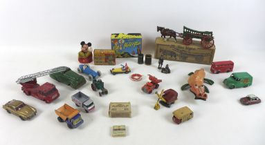 An interesting collection of vintage toys and die-cast vehicles including a damaged Tri-ang minic