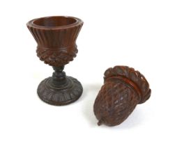 A 19th century carved treen nutmeg grater and a treen eggcup, the grater measures 4.5cm by 6.5cm and