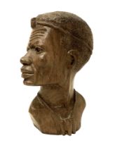 An African carved bust, signed 'D. Kakweza', 23cm high.