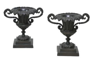 A pair of 19th century neo-classical bronze urn garnitures, with weighted bases, each 15.5 by10 by