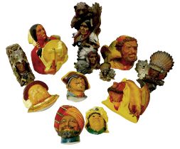 Seven Bossons heads including large American Indian, pirate, Arab with falcon and Henry VIII, plus