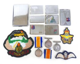Three WWl medals, three cloth badges and eight stamp/cigarette cases, the medals to 266298 SPR WH