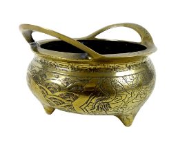 A large Chinese Ming period style polished bronze censer, squat circular form with twin handles,