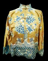 An early 20th century Japanese jacket, decorated with blue chrysanthemums and butterflies on a