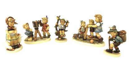 A group of five large Hummel china figurines, comprising Scooter Tim, Camera Ready (1977-2002 25