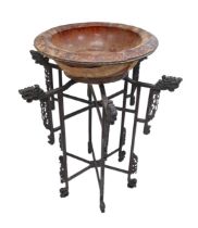 A Chinese carved wooden folding stand with associated bowl, 67 by 86 cm.