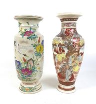 A 20th century Japanese Satsuma vase, decorate with a crane in flight within a floral landscape,