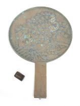 A Chinese bronze hand mirror and a drug weight, mirror 20cm by 30cm, weight 20.5 grammes.