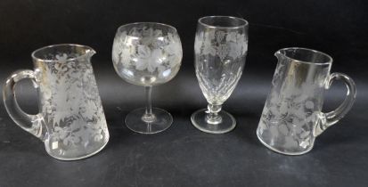 A group of four clear glass 19th century presentation vases / goblets, comprising one tall clear