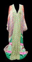 A 1970s Thea Porter Couture kaftan, made of various green, pink, red and purple ground panels,