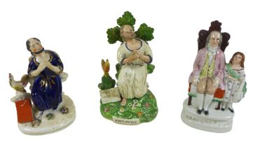 A group of eight Staffordshire figures, two of Saint Peter and one titled 'Grandpa's Joy', largest