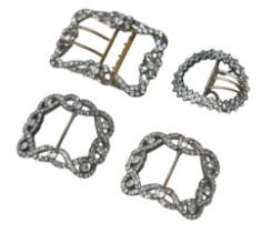 A group of four 19th century buckles, including one pair of white metal, each 5.5 by 5 by 1.5cm,