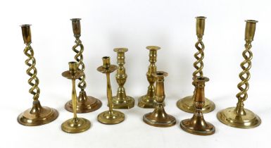 Five pairs of Georgian and later brass candlesticks, tallest 29.5cm high. (10)