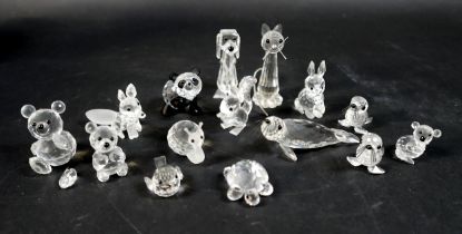 A collection of fifteen Swarovski animal figurines, including a panda, a seals, teddy bears, a snail