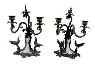 A pair of bronze and milk glass twin branch candlesticks, possibly French 19th century, each with