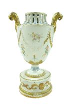 A GB Nove style twin handled vase, with lions head mount handles, pierced decoration to its top,